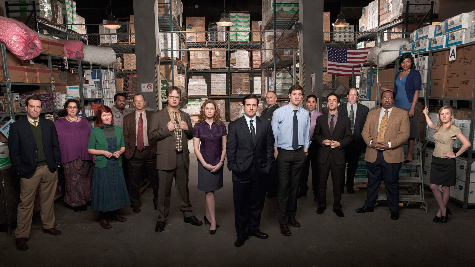 The Office ensemble promo with the Scranton branch standing in the warehouse.