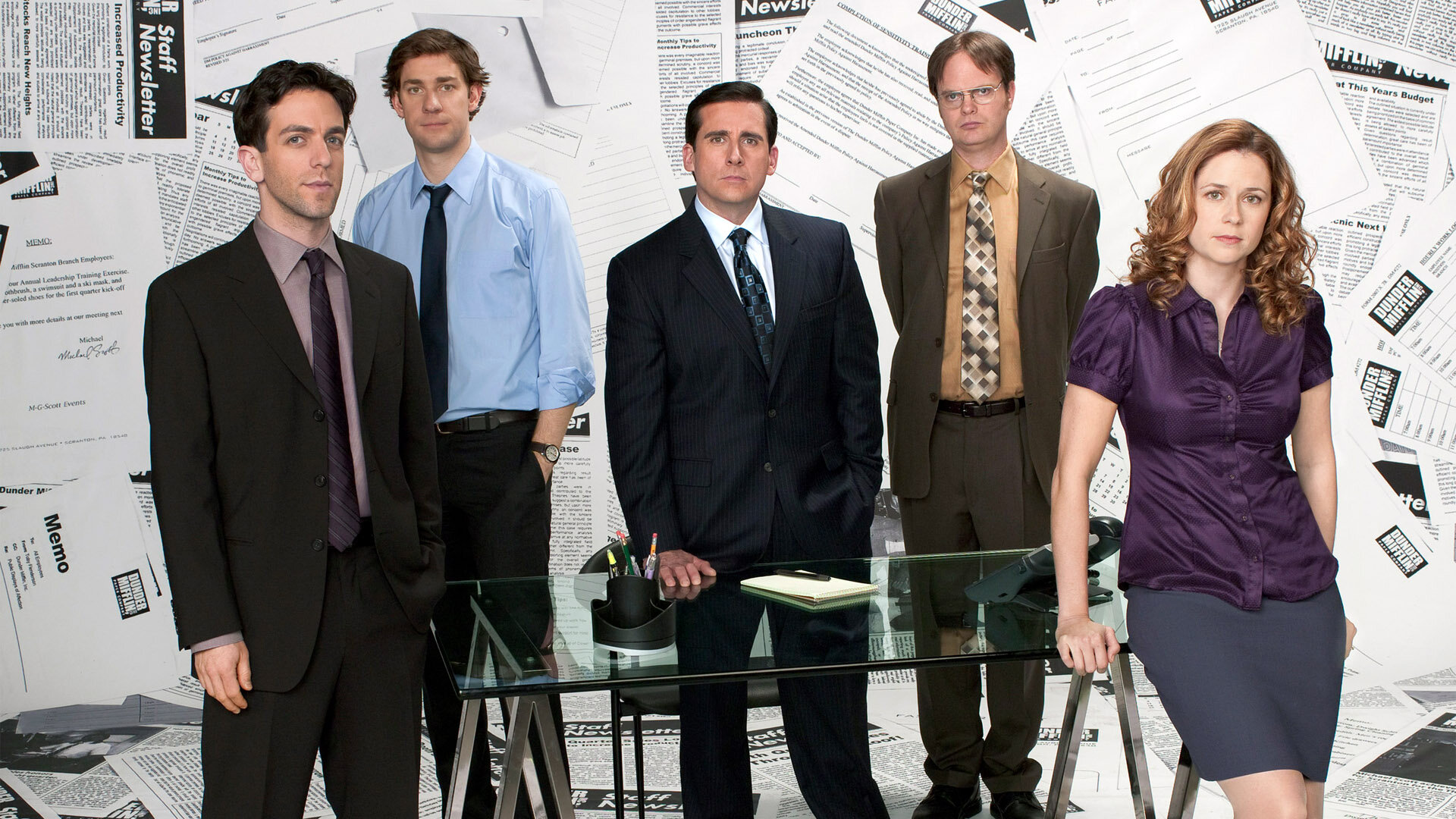 The Office cast promo featuring Ryan Howard, Jim Halpert, Michael Scott, Dwight Schrute, and Pam Beesly in front of a paper backdrop.